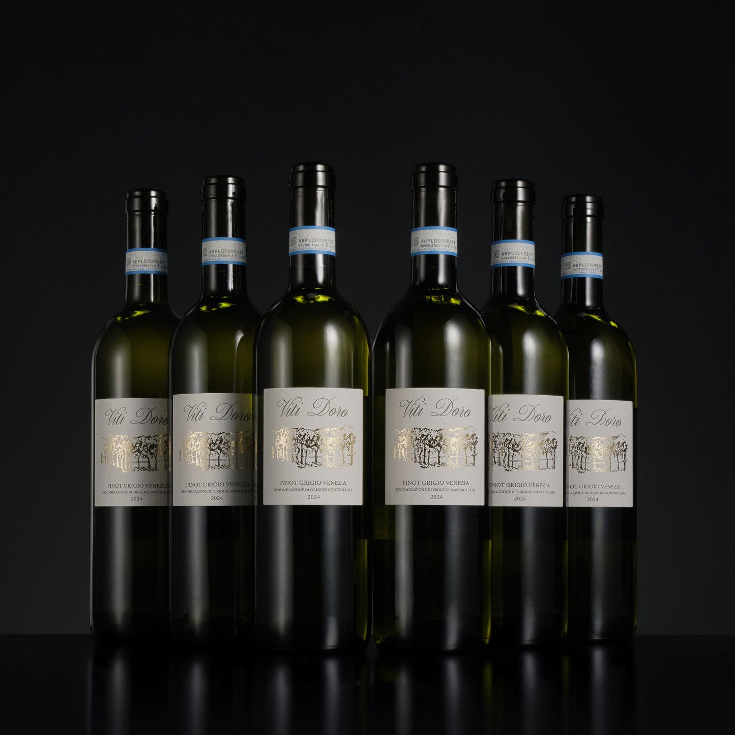 Seven bottles of Viti Loria wine arranged in a row on a black background