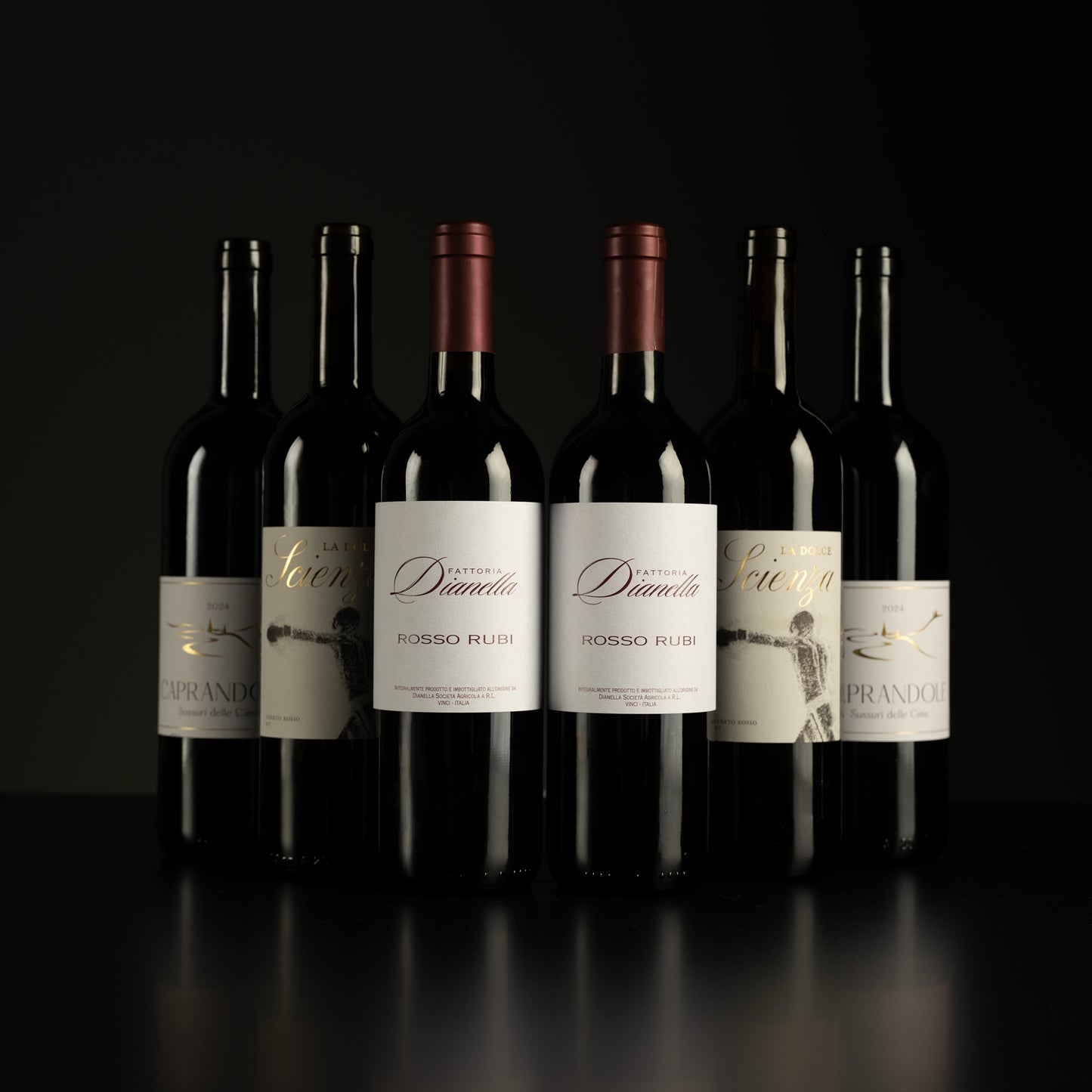 Row of wine bottles with labels on a dark background