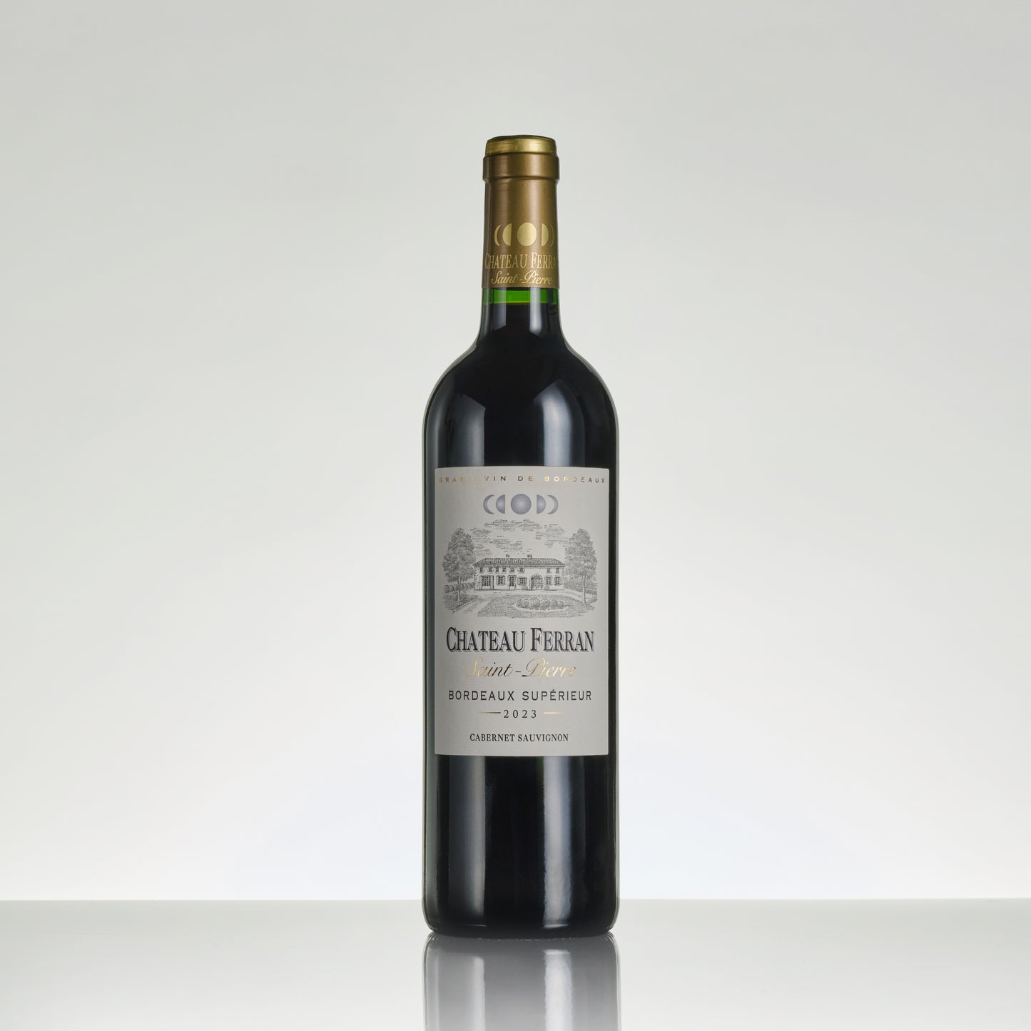 Red wine bottle with Chateau Ferran label on a white background