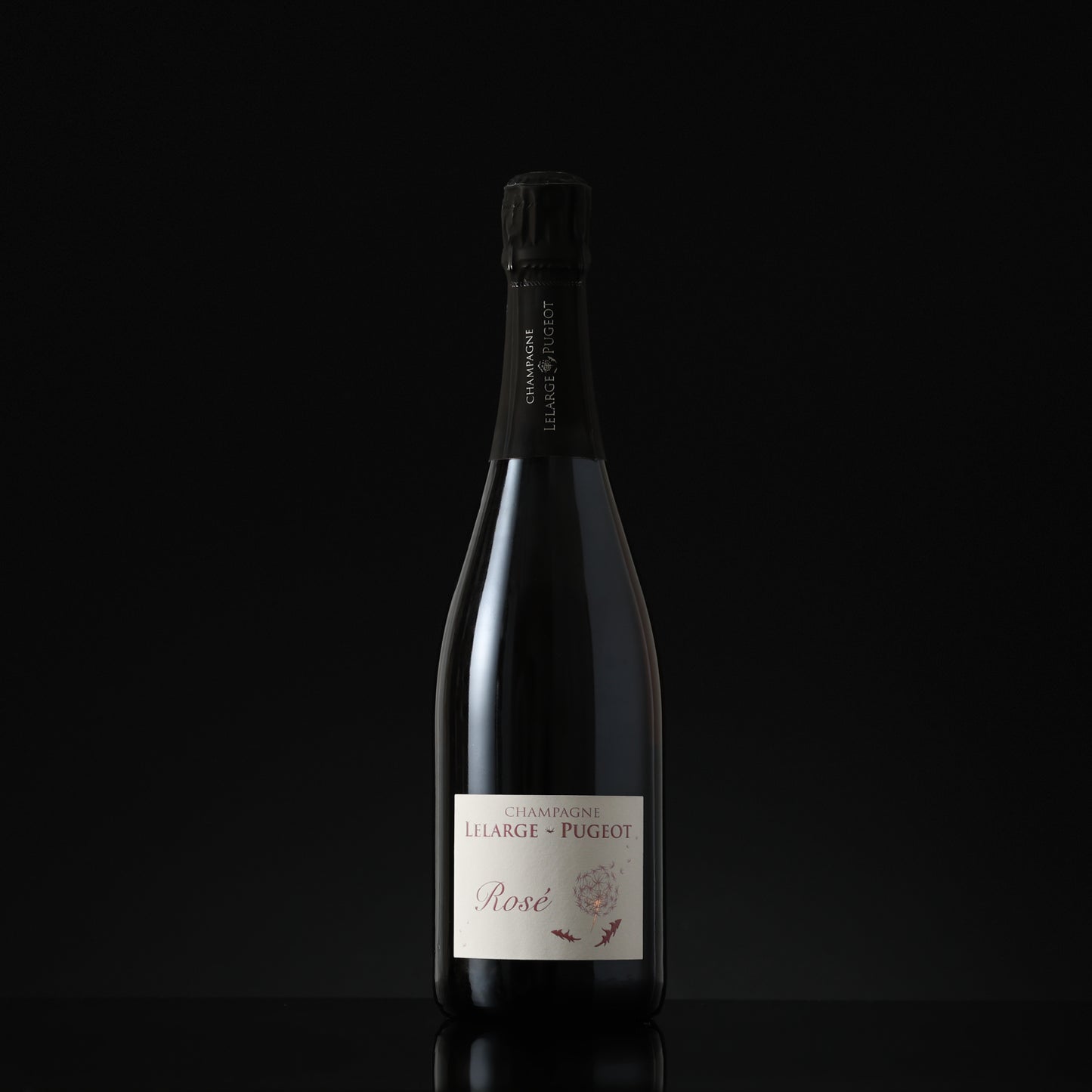 Bottle of champagne with a visible label on a black background