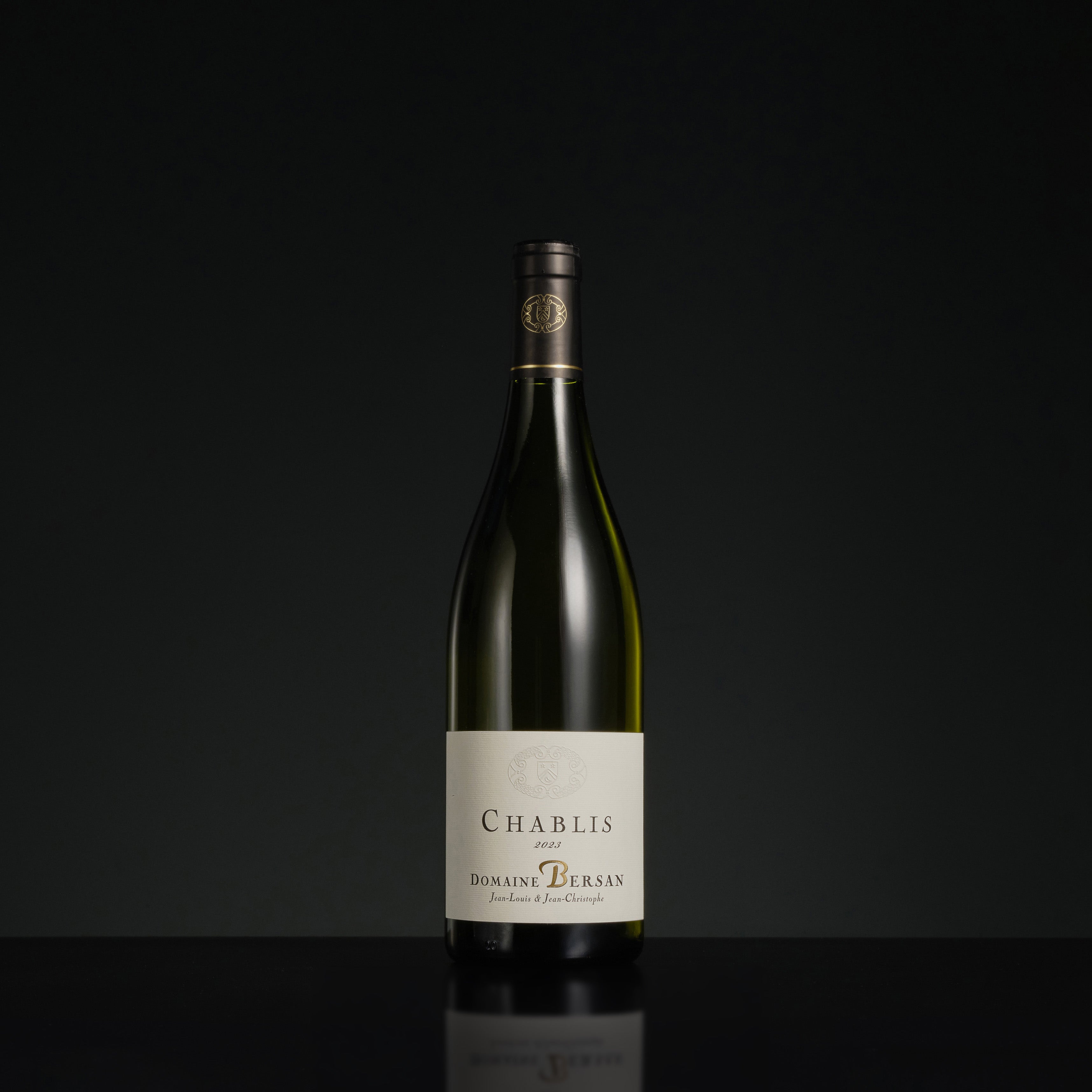 Bottle of Chablis wine on a black background