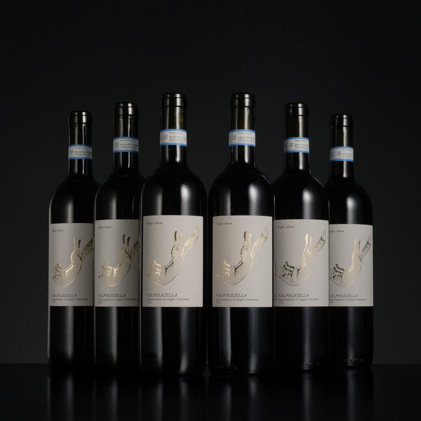 Seven bottles of wine with labels on a black background