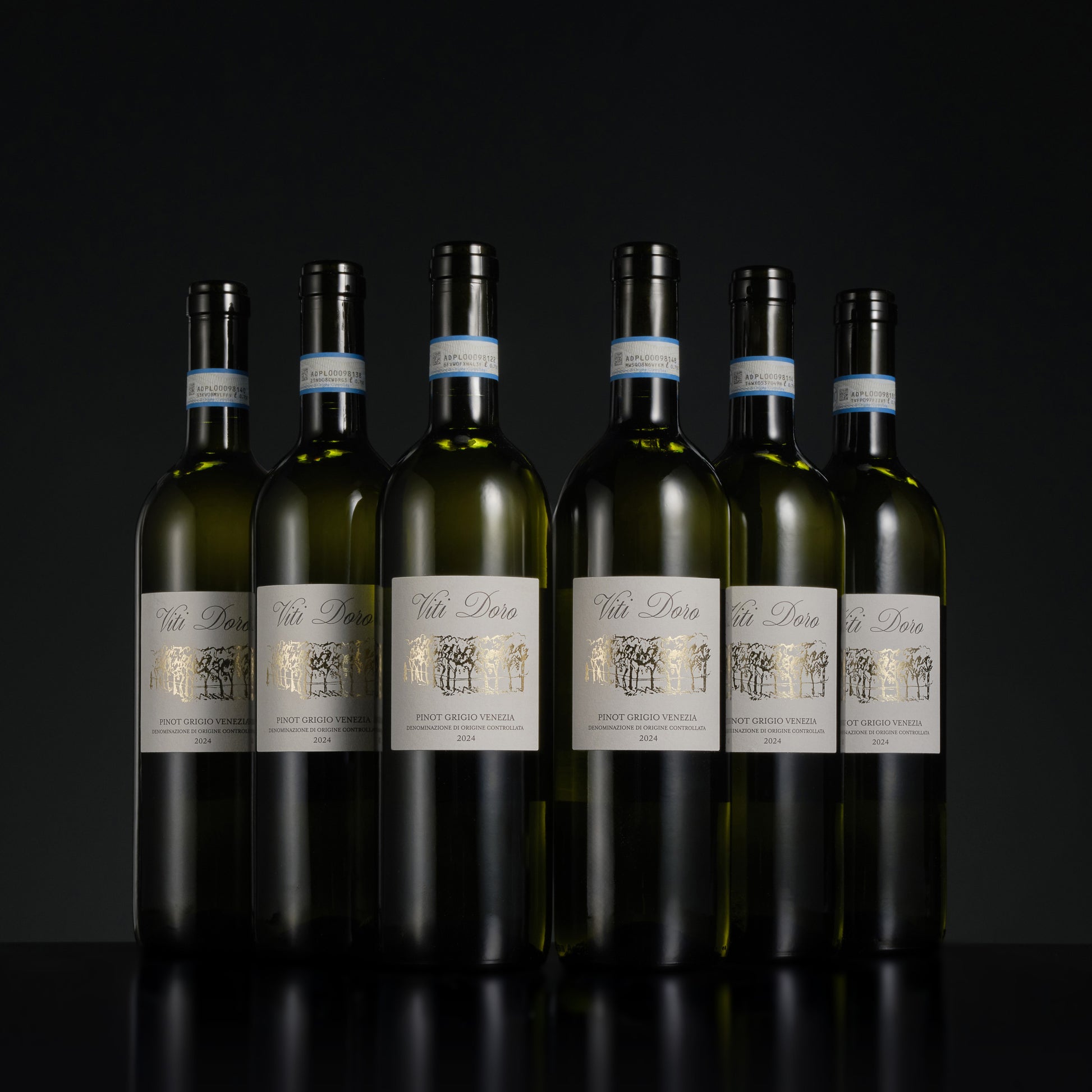 Seven bottles of Viti Loria wine arranged in a row on a black background