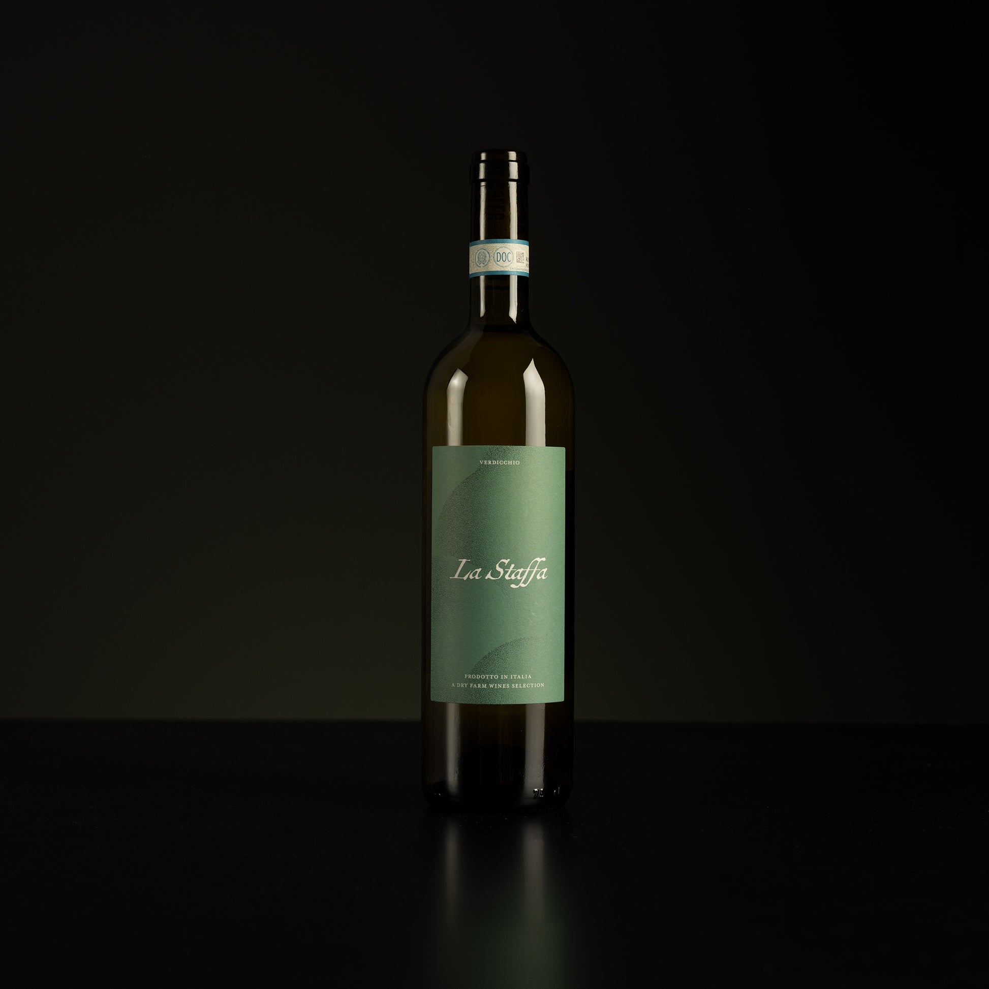 Wine bottle with a green label on a black background
