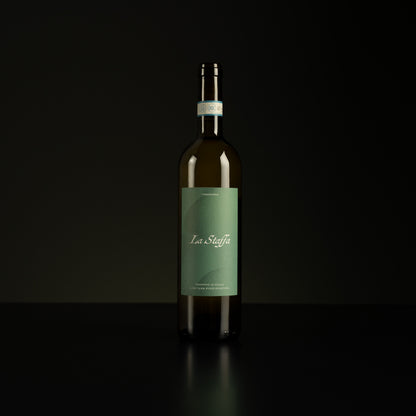 Wine bottle with a green label on a black background