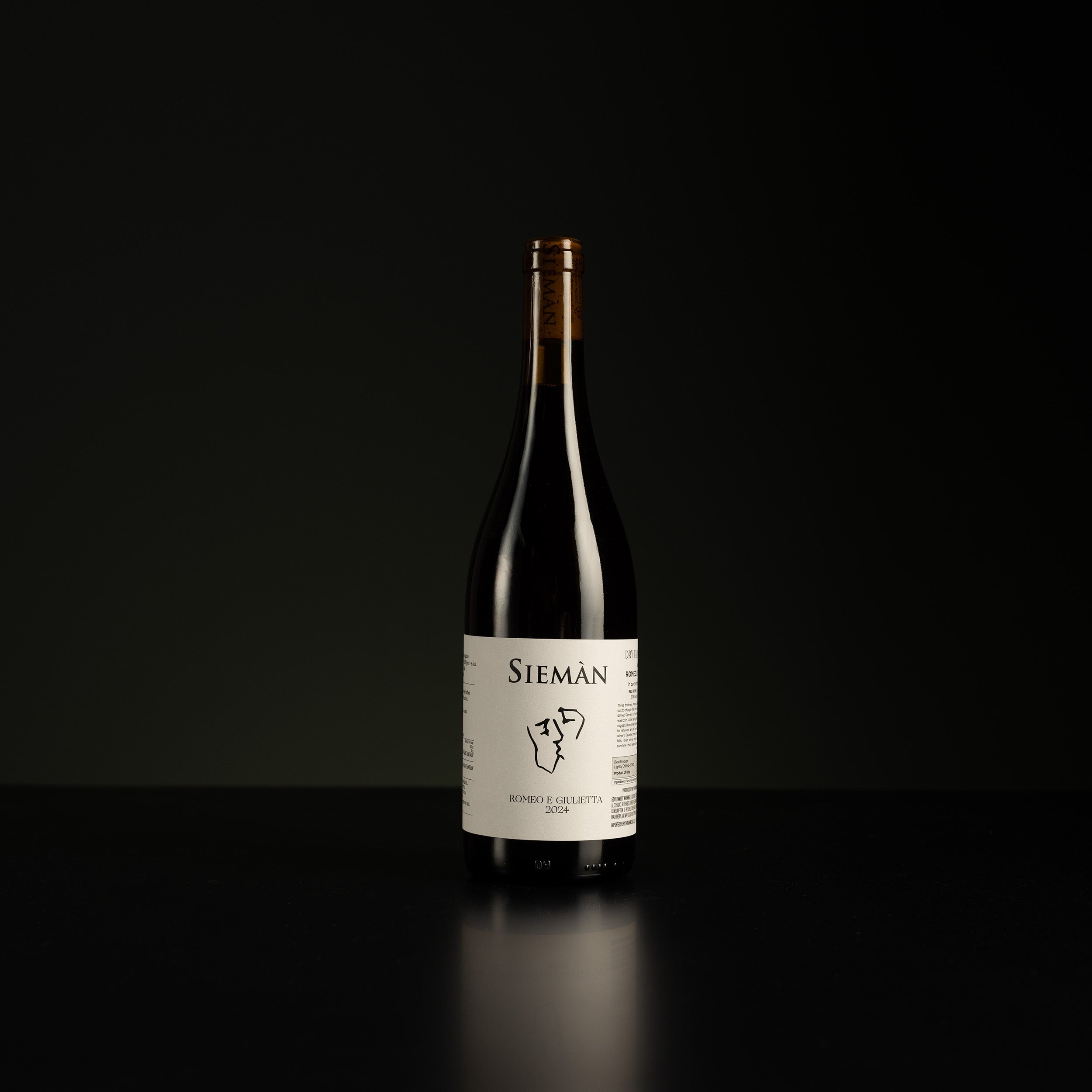 Wine bottle with a label on a black background