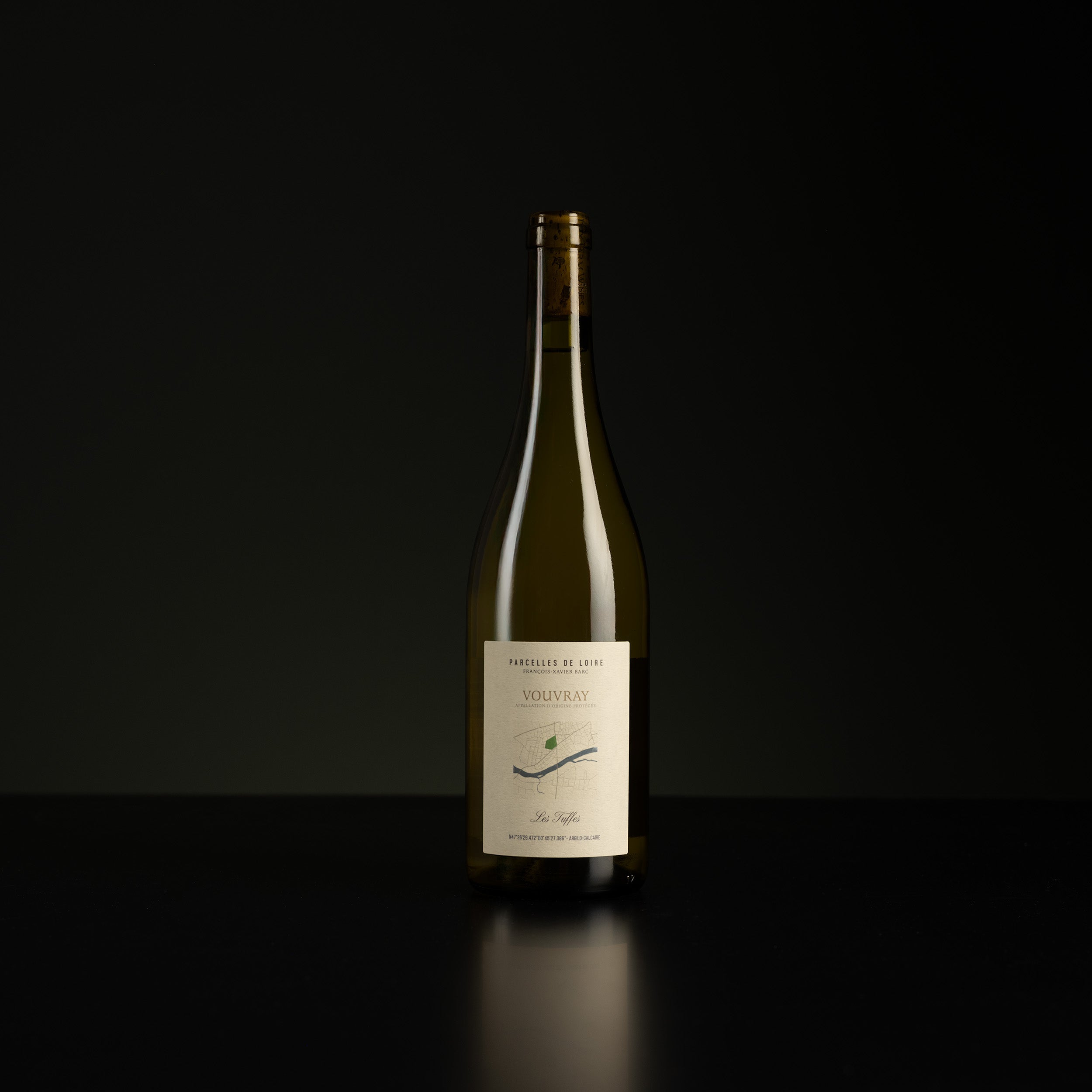 Wine bottle with a label on a black background