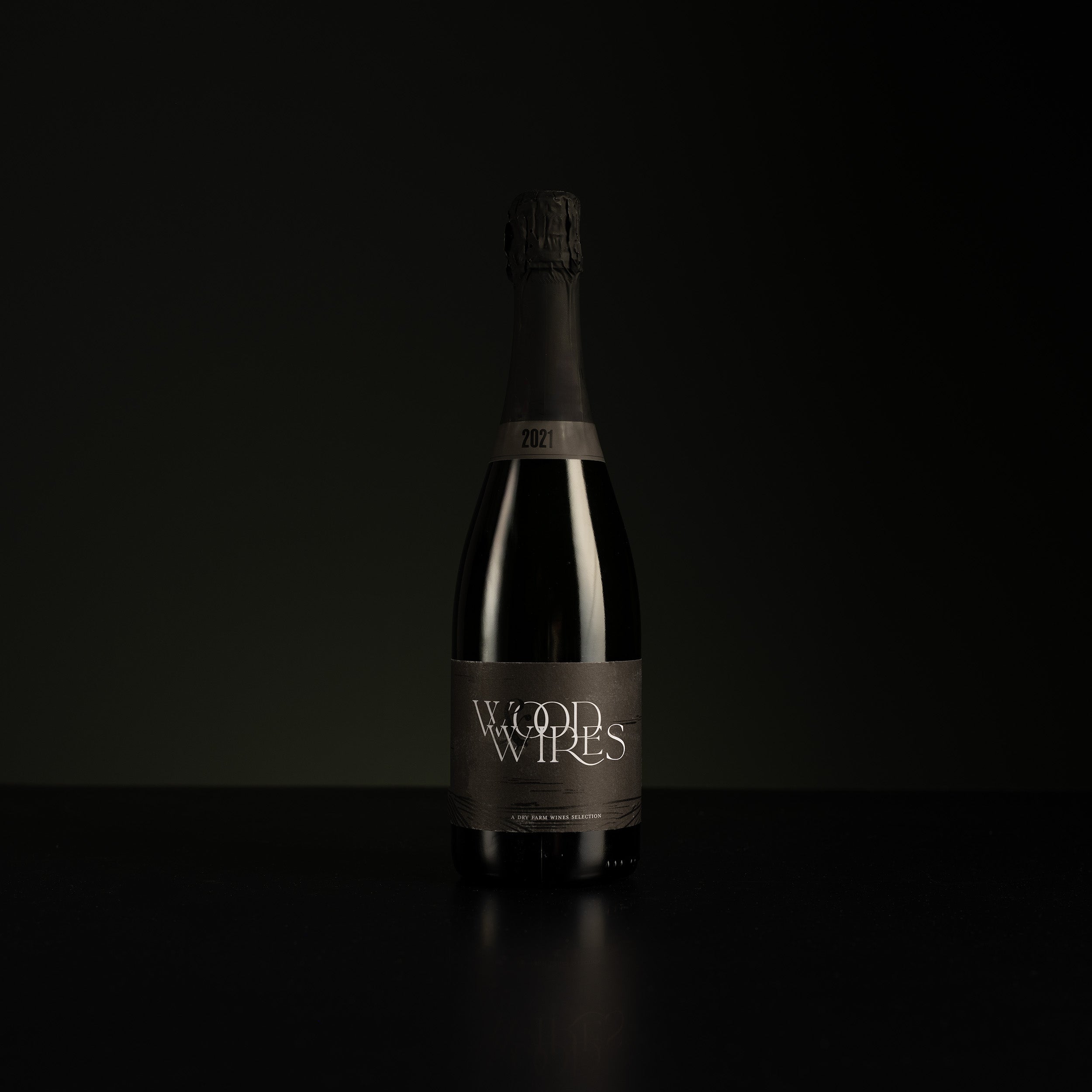 Bottle of Wood Wires wine on a black background