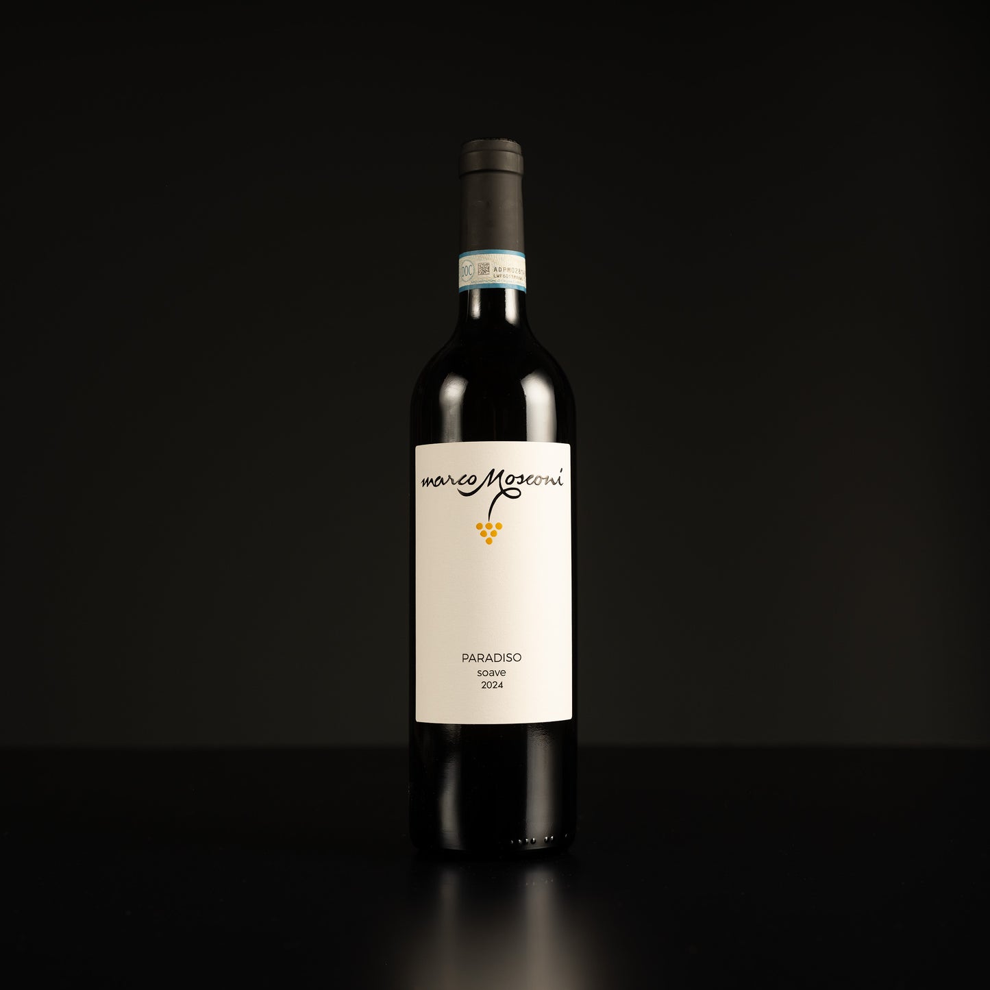 Wine bottle with a white label on a black background
