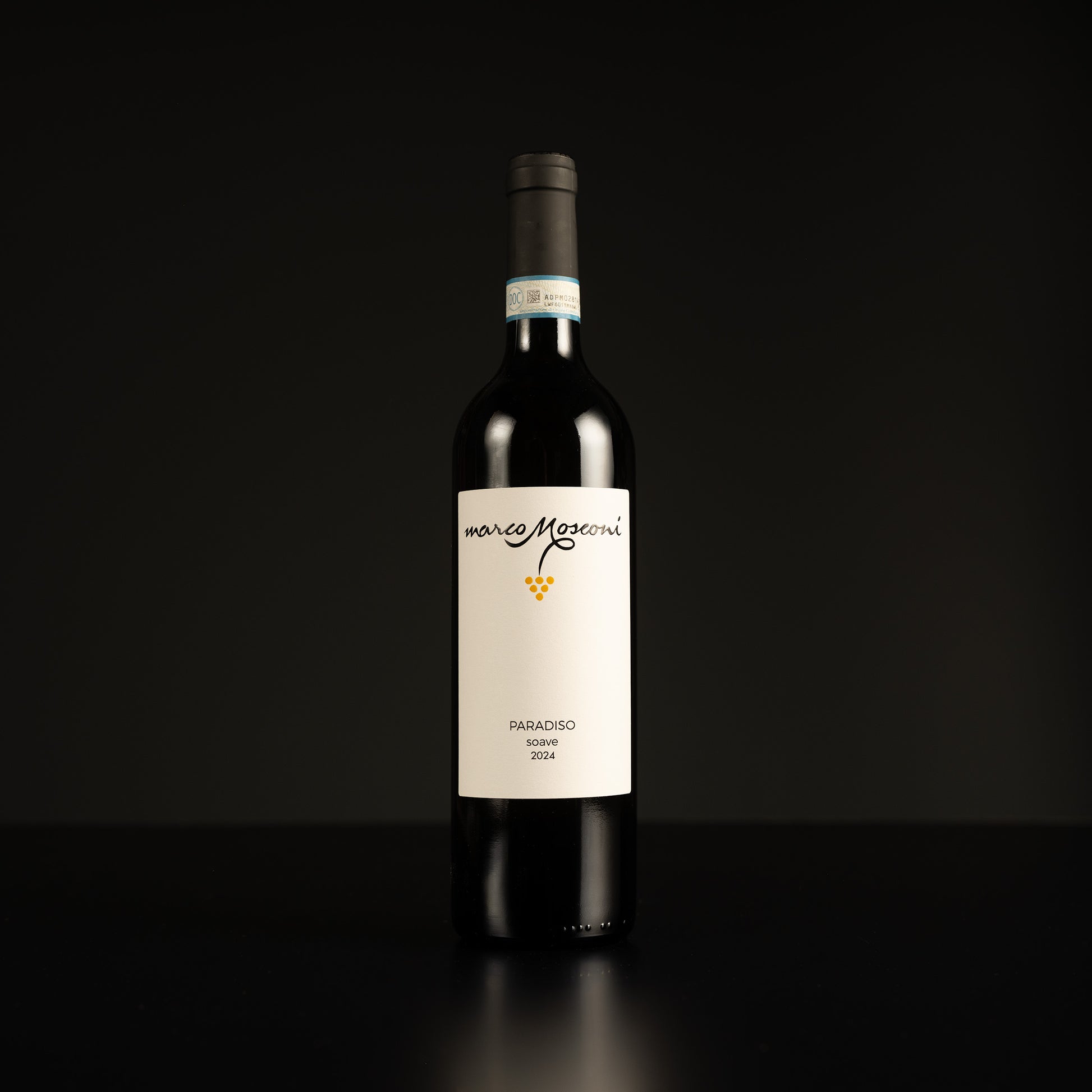 Wine bottle with a white label on a black background