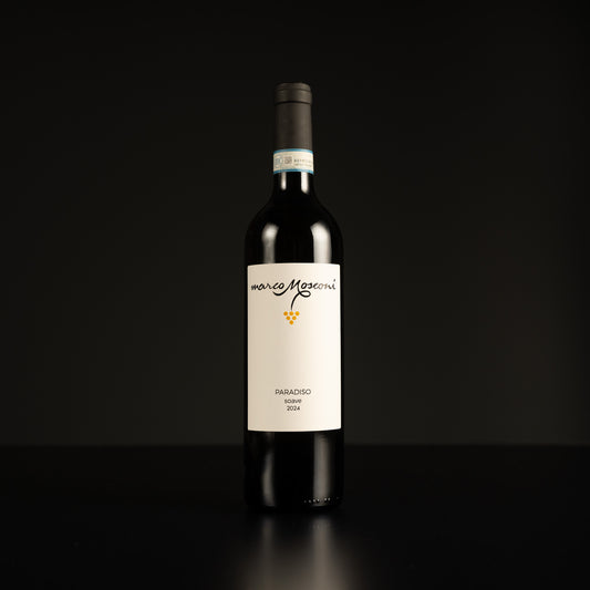 Wine bottle with a white label on a black background