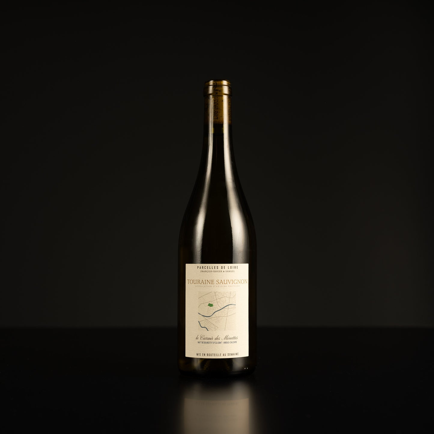 Wine bottle with a label on a black background
