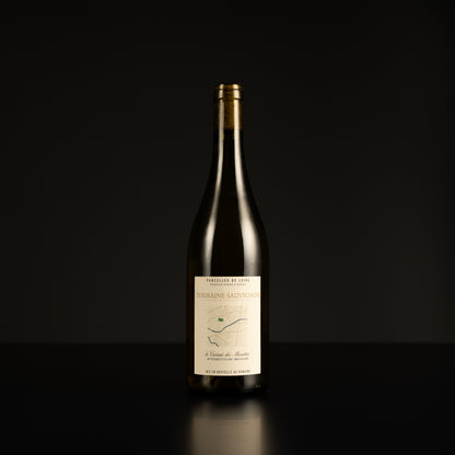 Wine bottle with a label on a black background