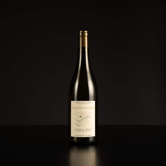 Wine bottle with a label on a black background