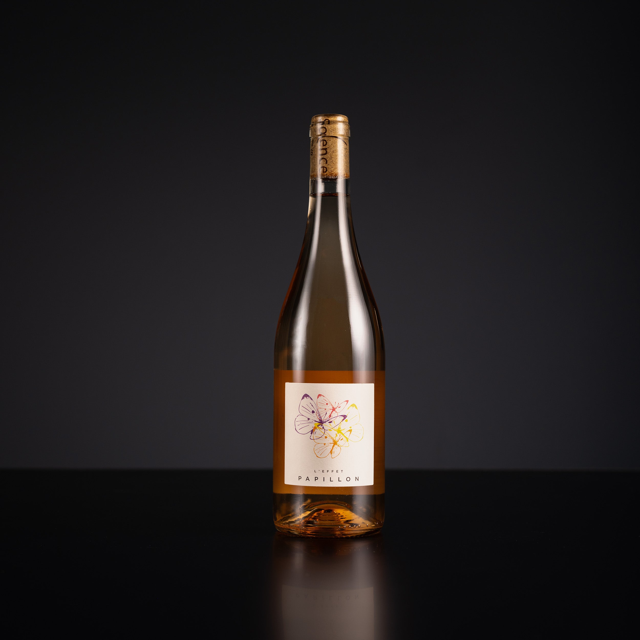 Wine bottle with a label on a black background