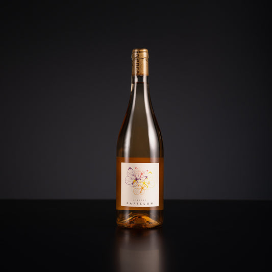 Wine bottle with a label on a black background