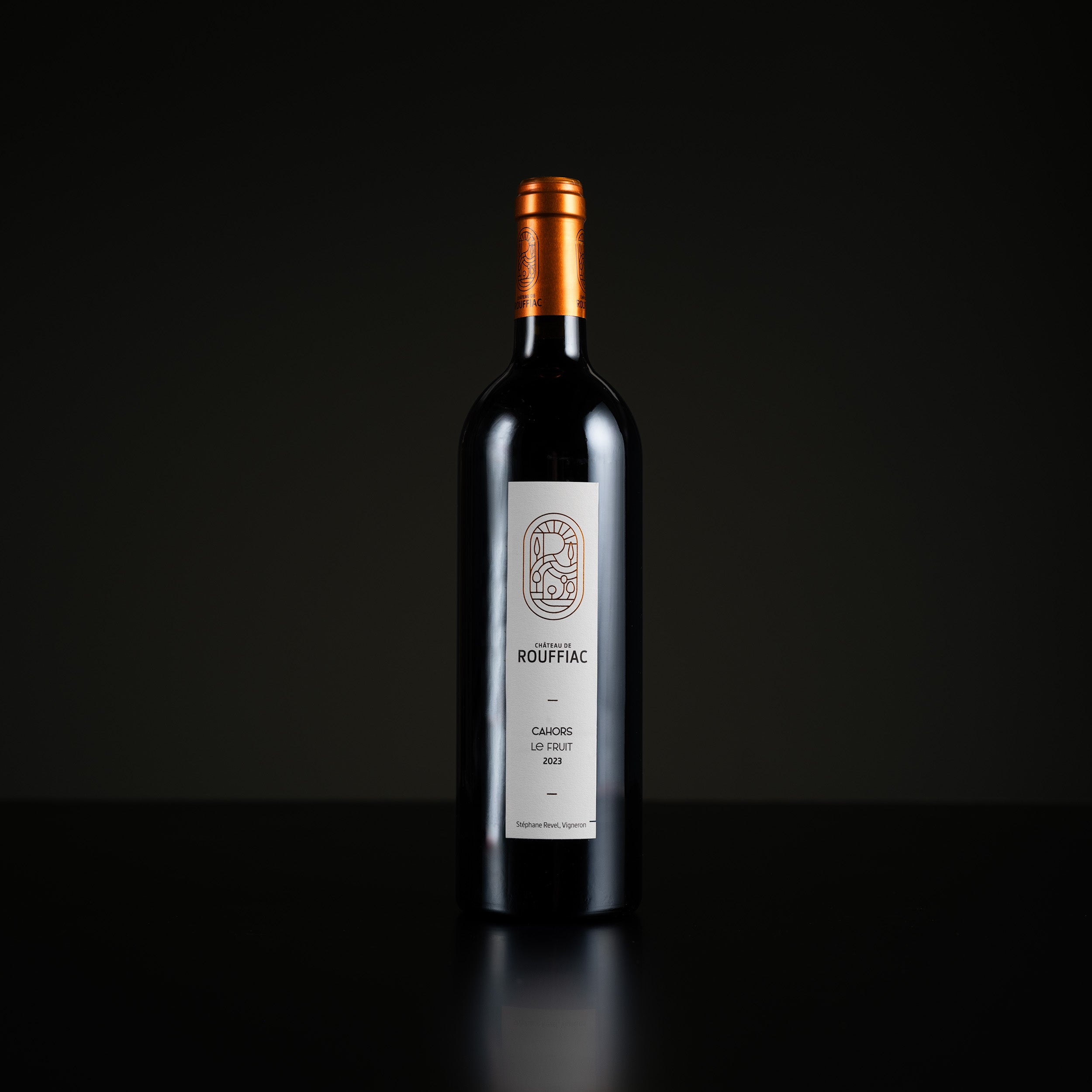 Wine bottle with a label on a black background