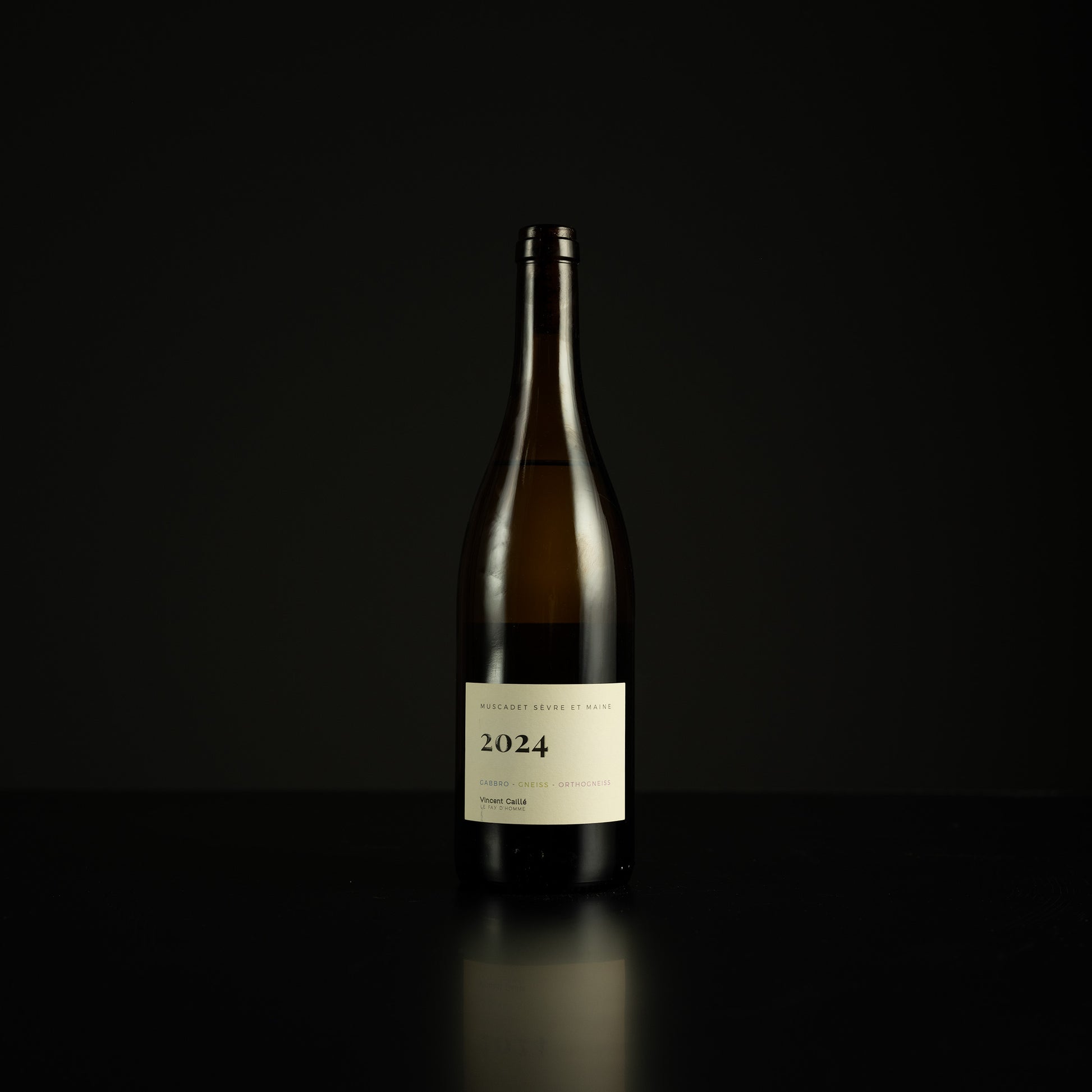 Wine bottle with a label on a black background