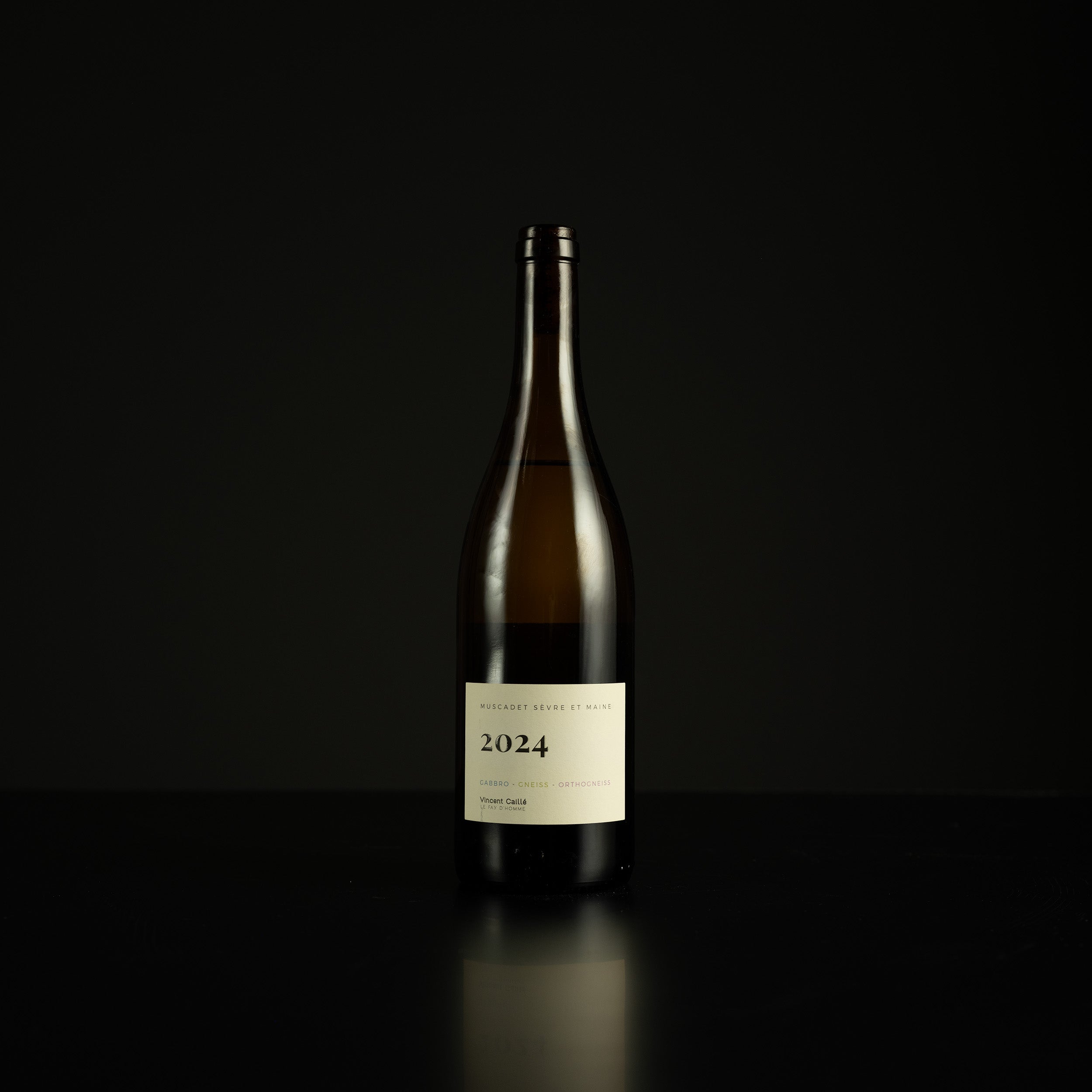 Wine bottle with a label on a black background
