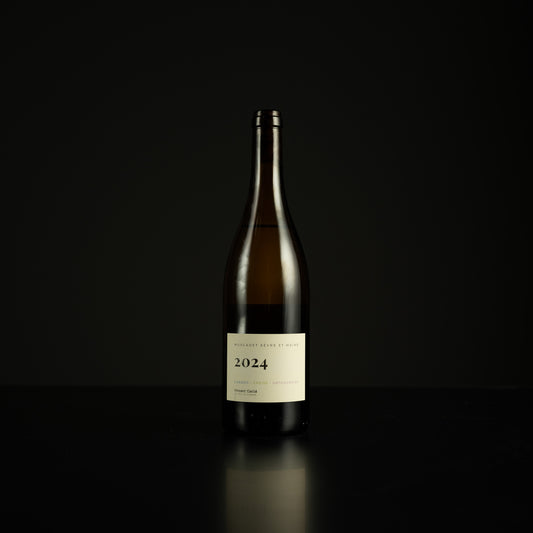 Wine bottle with a label on a black background