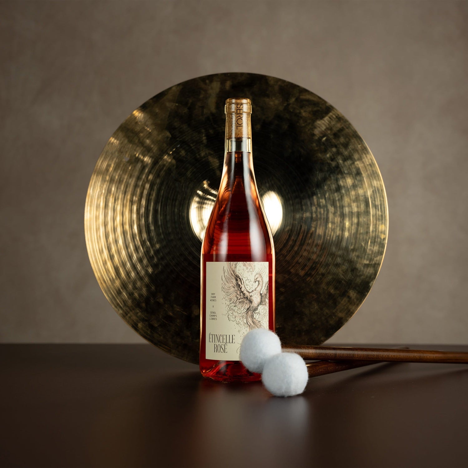 Bottle of wine with decorative elements on a dark surface