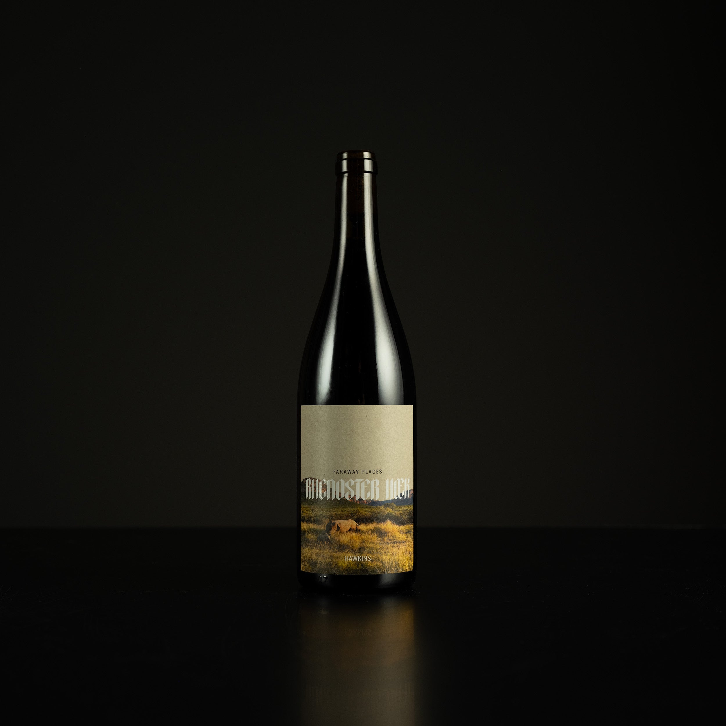 Wine bottle with a label on a black background