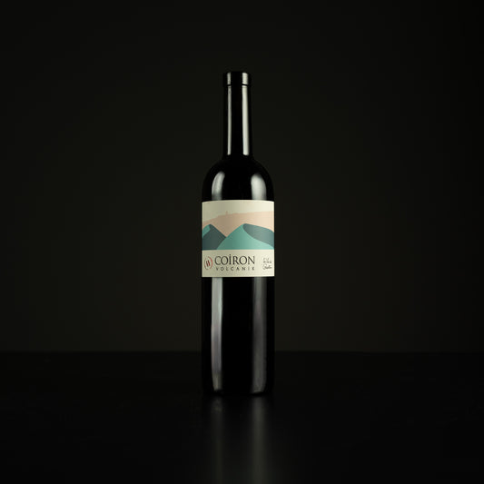 Wine bottle with a label on a black background