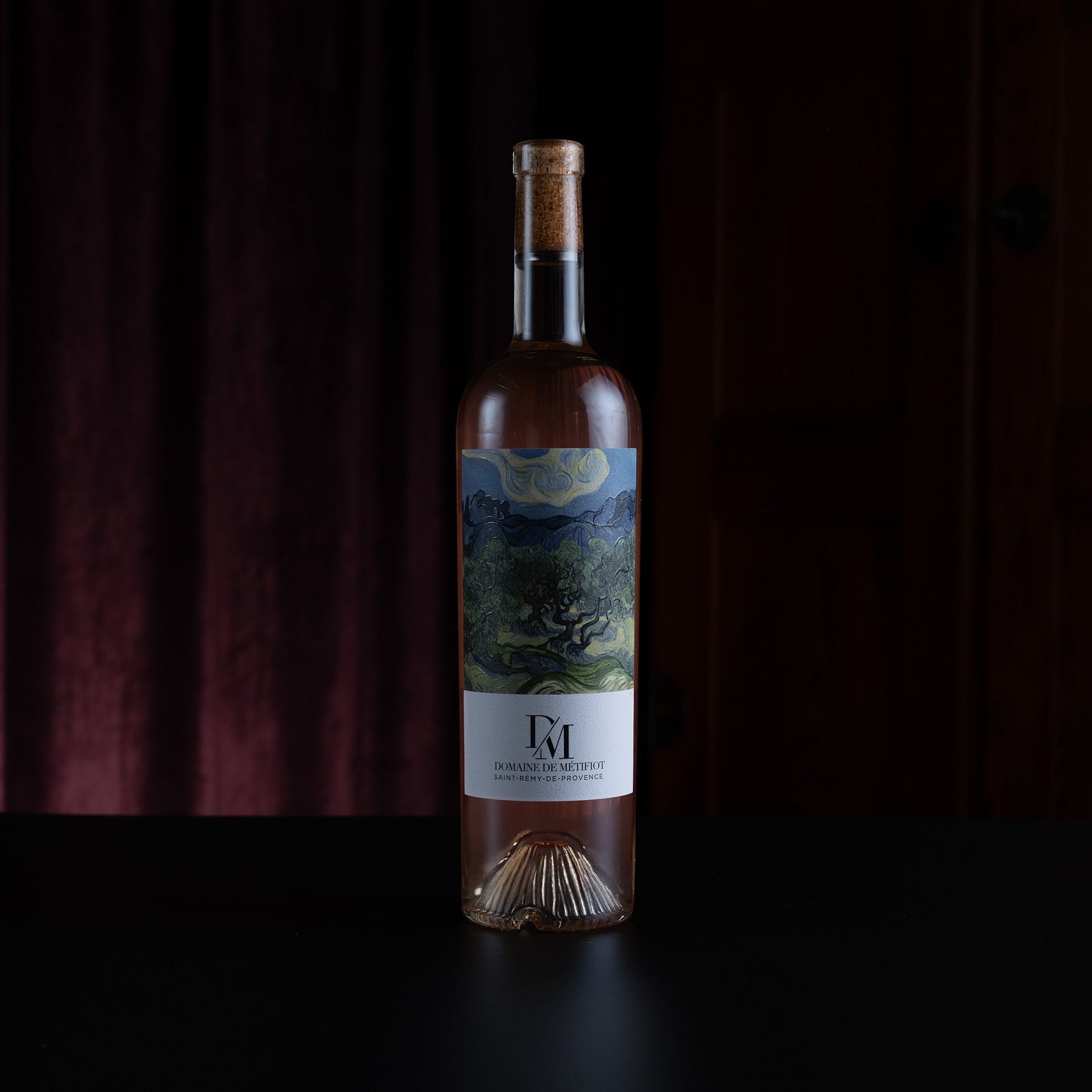 Wine bottle with a label on a dark background