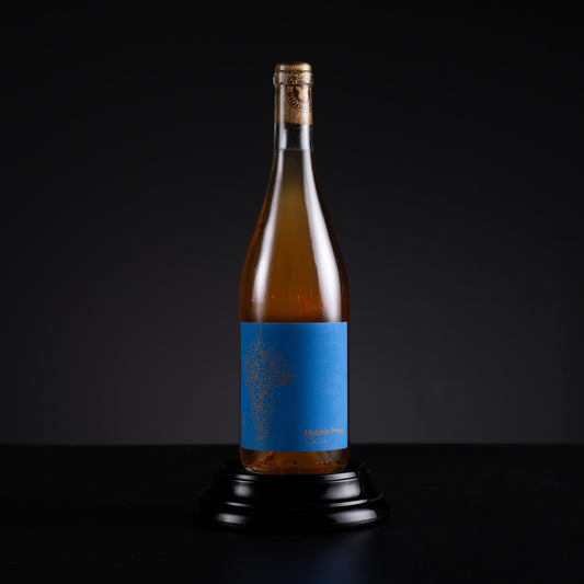 Wine bottle with a blue label on a black background