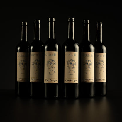 Six bottles of L'archetipo wine arranged in a row on a black background