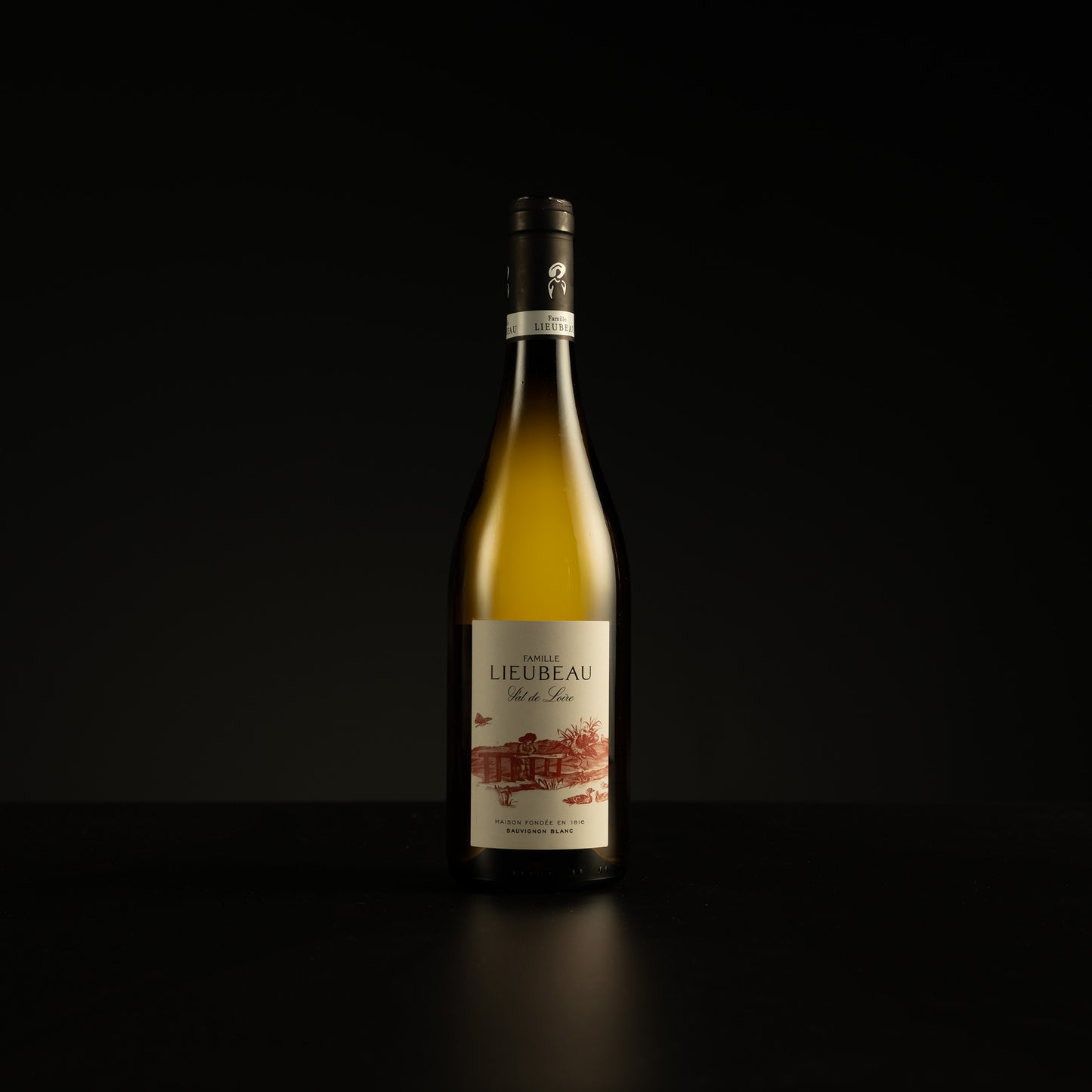 Wine bottle with Lieubeau label on a black background