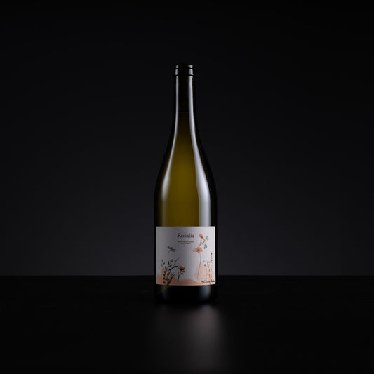 A single bottle of Rosalia Rosé wine with a white label featuring delicate floral illustrations, set against a solid black background.