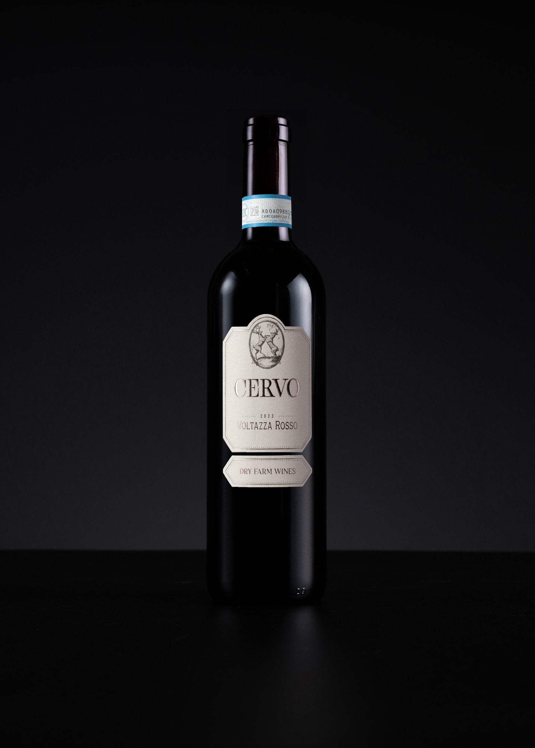 A single dark wine bottle with a cream-colored label reading 'VERVO' and 'Veltziboll Red' stands centered against a black background.