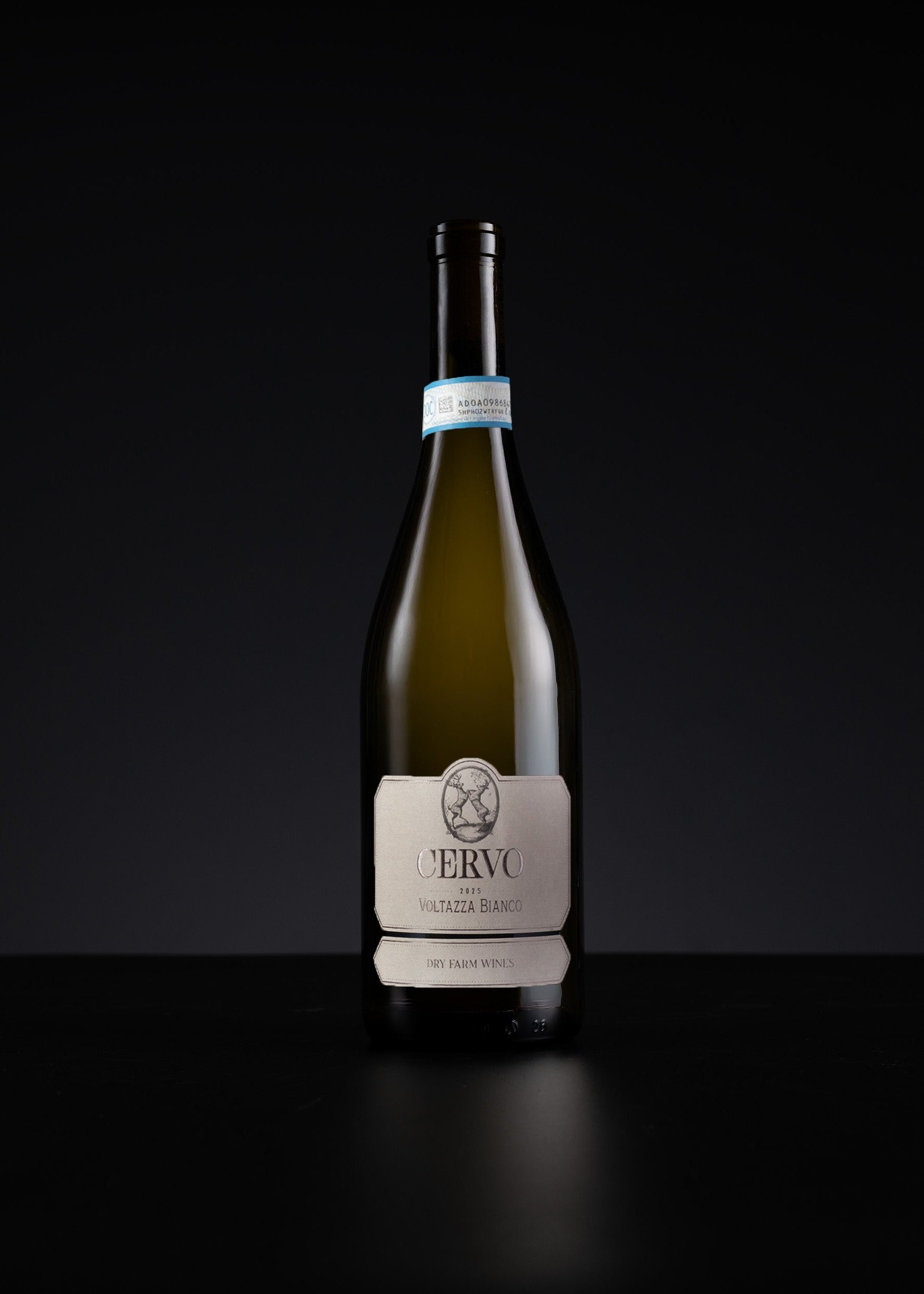 A single bottle of white wine centered on a dark black background, with a cream label and visible brand text reading JERVÁO.