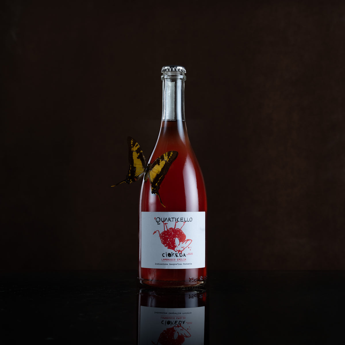 Bottle of sparkling red wine with butterfly
