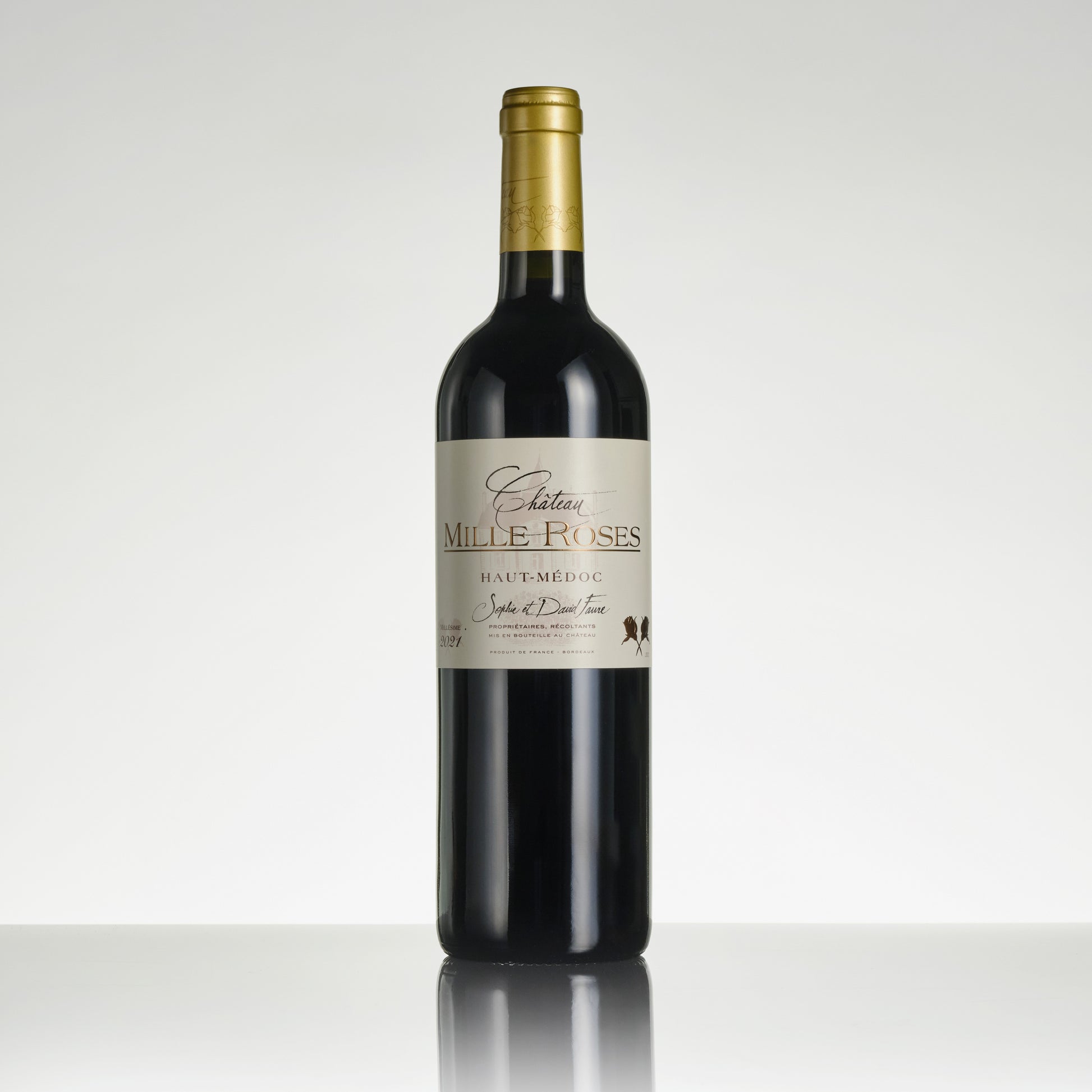 Wine bottle labeled 'Chateau Mille-Roses' on a white background