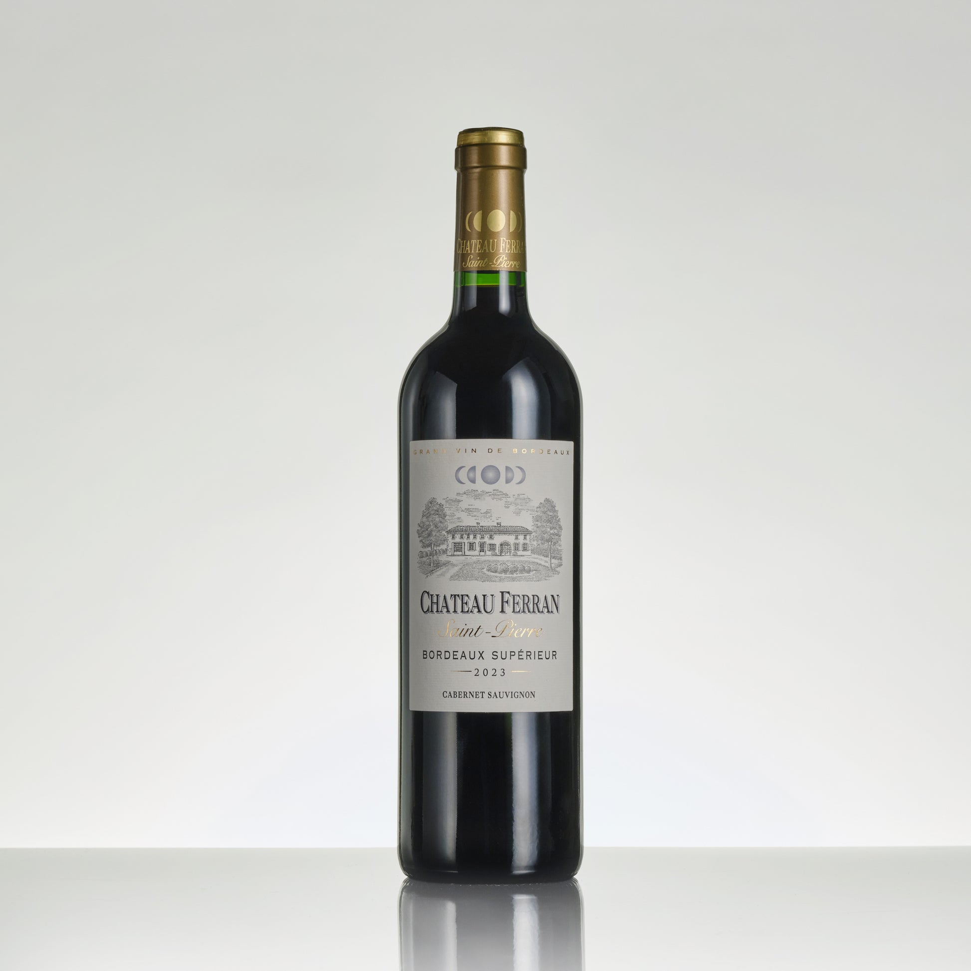 Red wine bottle with Chateau Ferran label on a white background