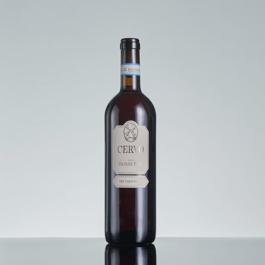 Bottle of Cervo wine on a reflective surface with a light gray background