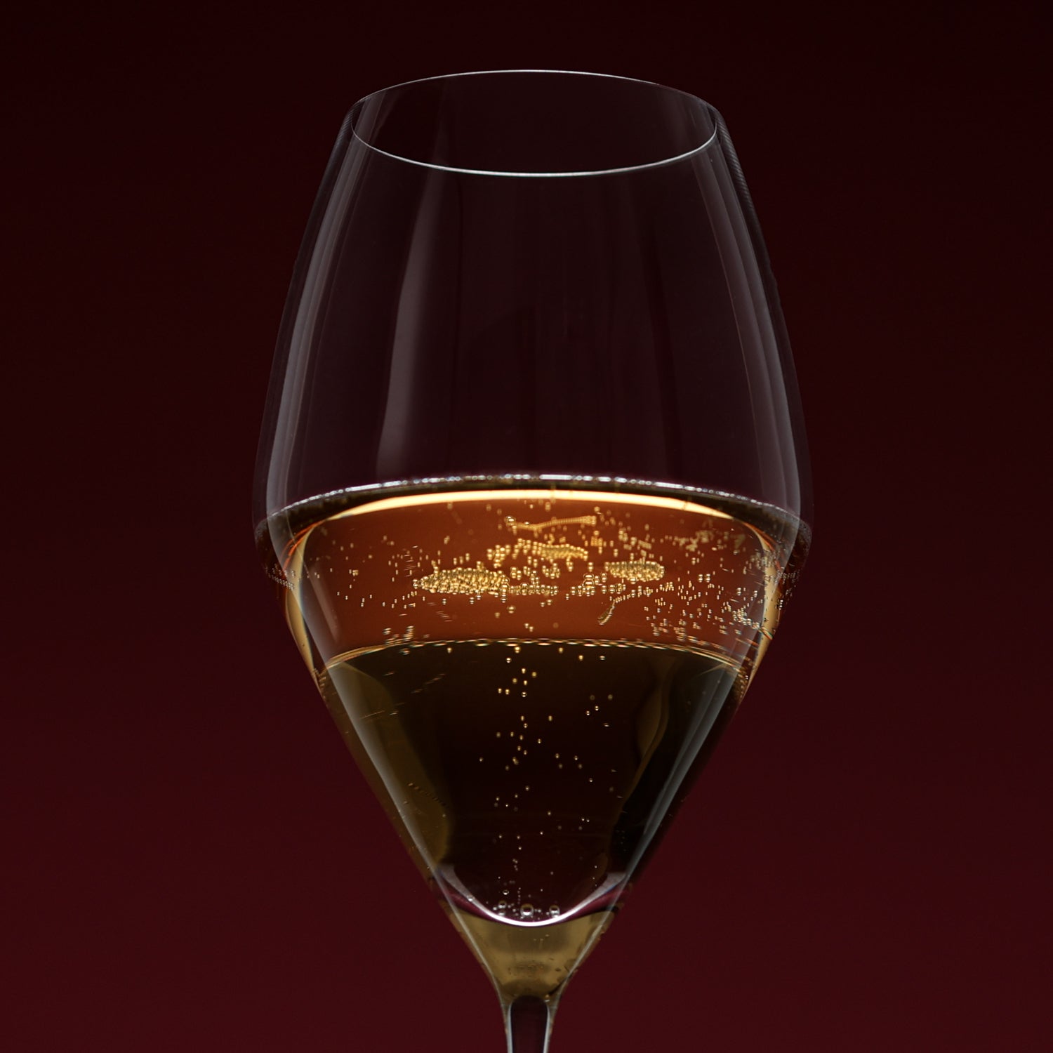 Glass of sparkling wine with a dark background