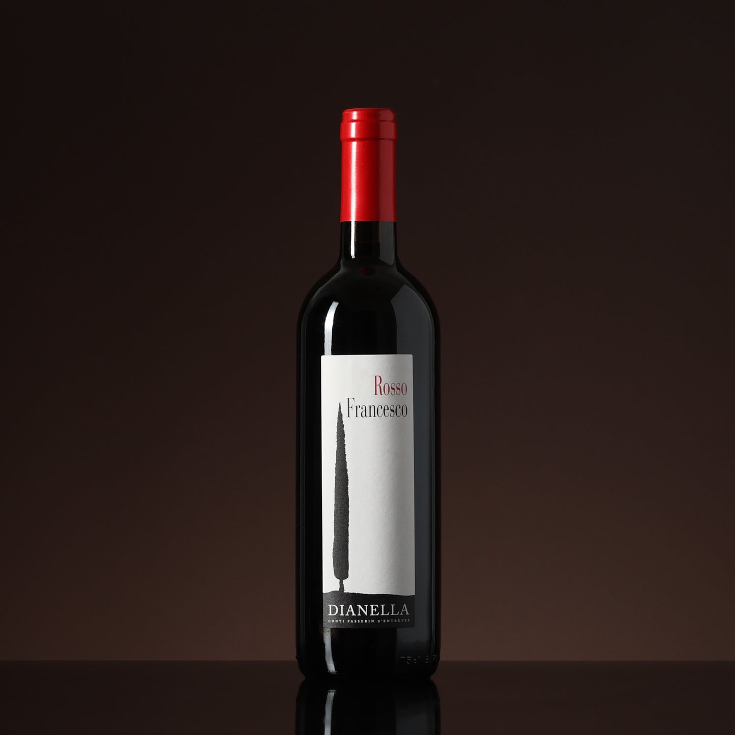 Wine bottle with a red cap and white label on a dark background