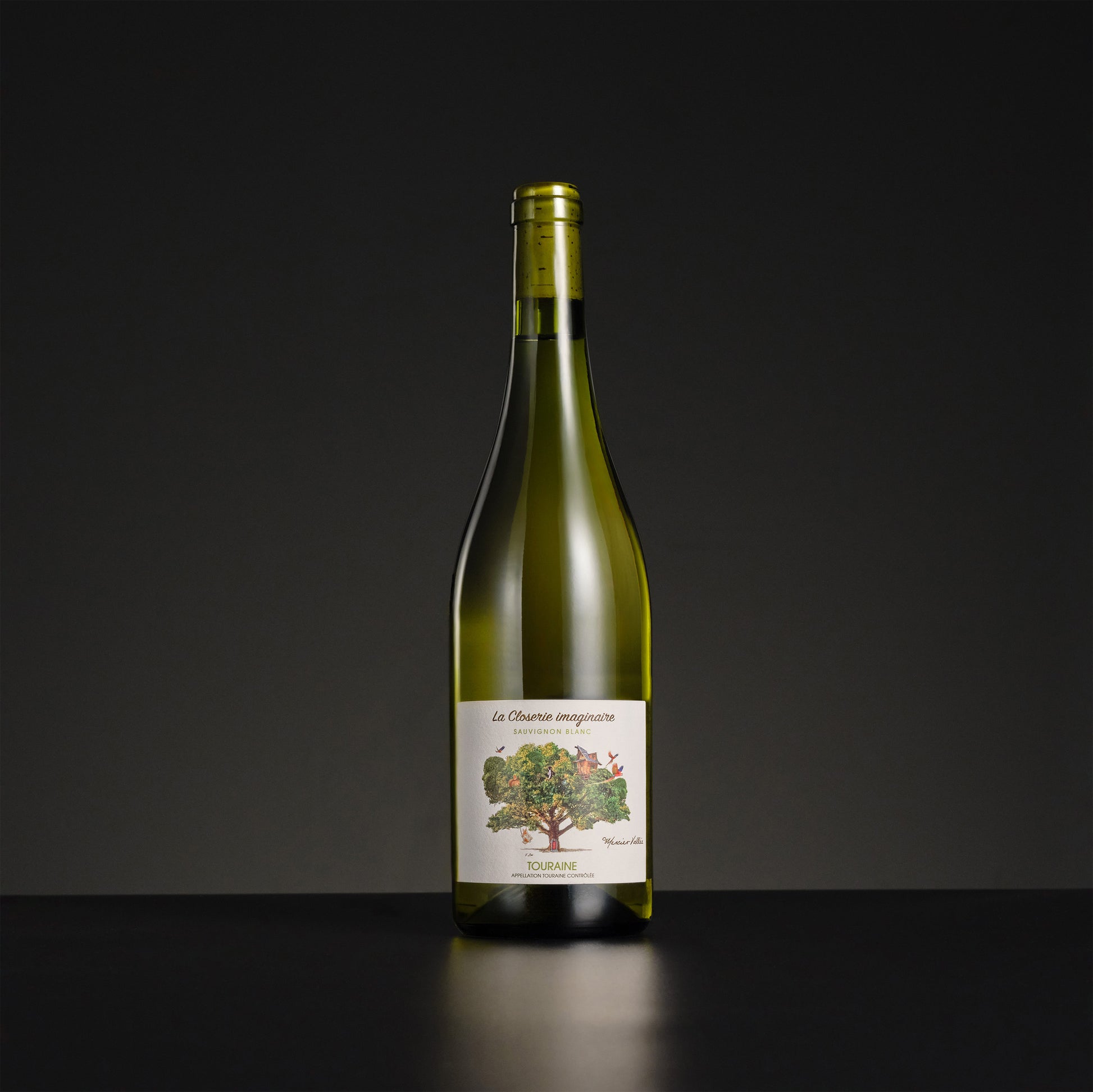 Green wine bottle with a label on a black background