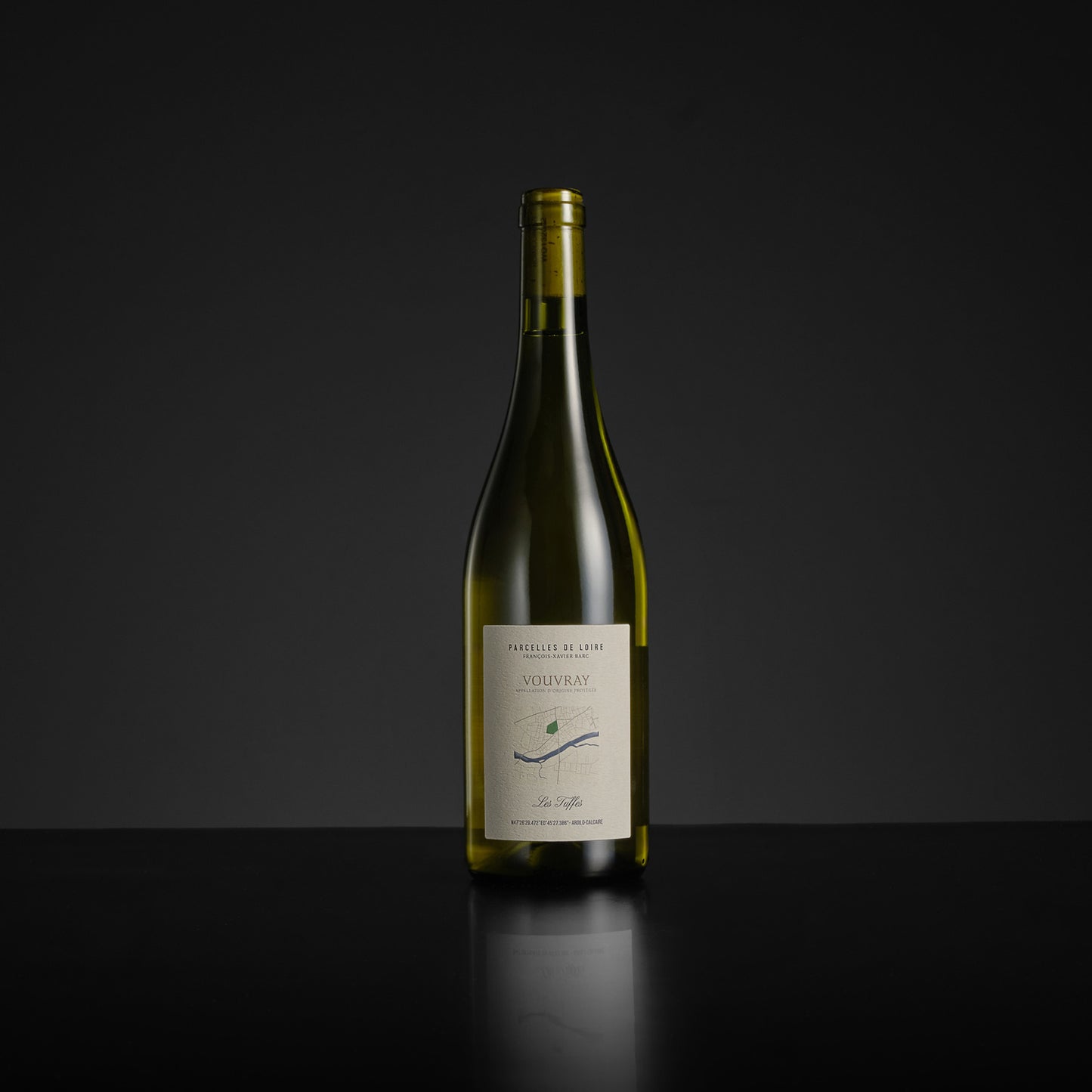 Wine bottle with a label on a black background