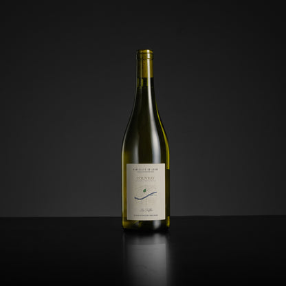 Wine bottle with a label on a black background