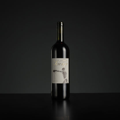 Wine bottle with a label on a black background