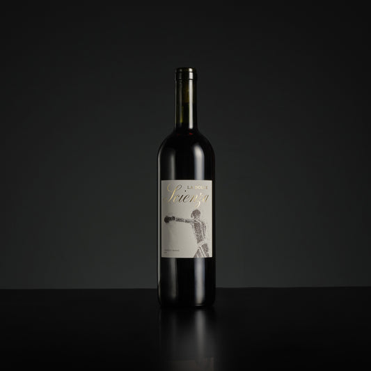 Wine bottle with a label on a black background