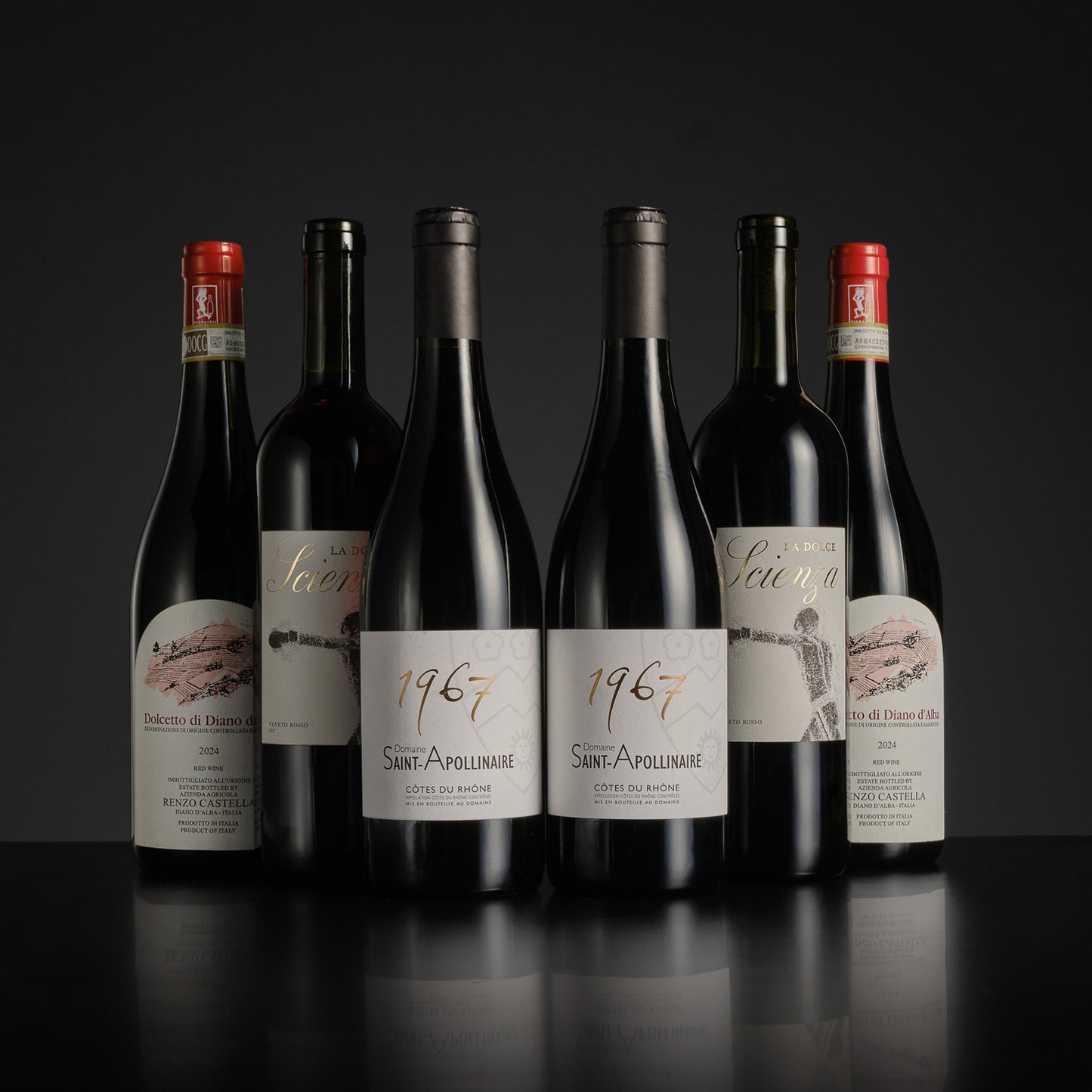 Collection of wine bottles with labels on a dark background