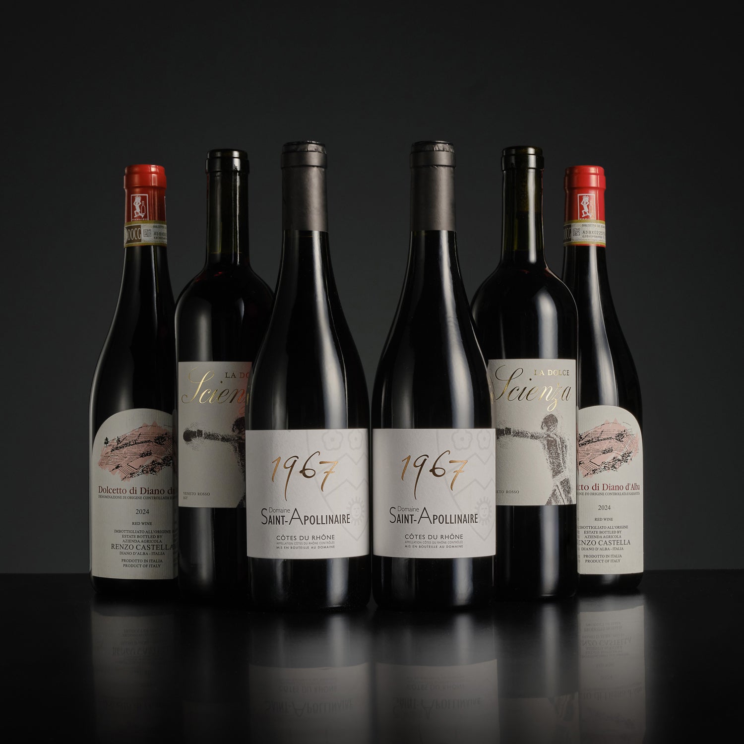 Collection of wine bottles with labels on a dark background