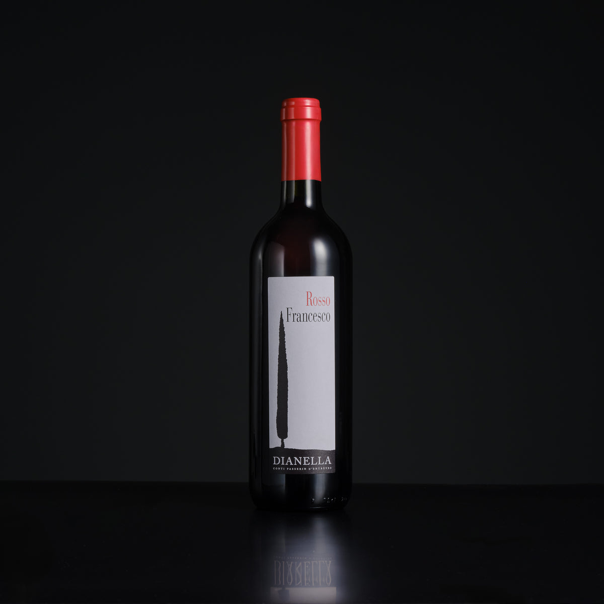 Wine bottle with a red cap and visible label on a black background