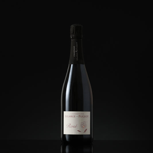 Bottle of champagne with a visible label on a black background
