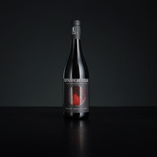Wine bottle with a dark label on a black background